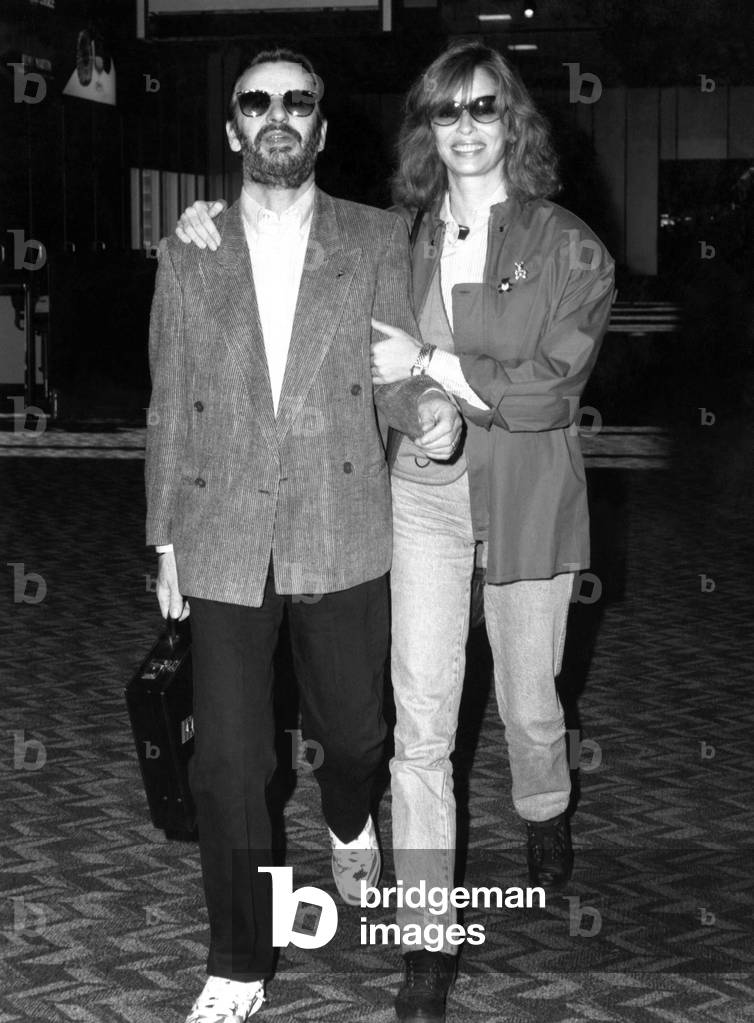 Ex-Beatle Ringo Starr and his wife Barbara Bach were spotted leaving London's Heathrow Airport. (13.10.87). November 1987