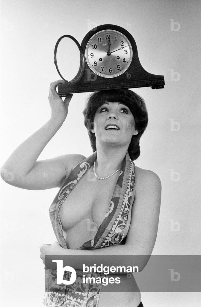 Model reminding people to put their clocks back by one hour at the end of British Summer Time. 25th October 1979 (b/w photo)