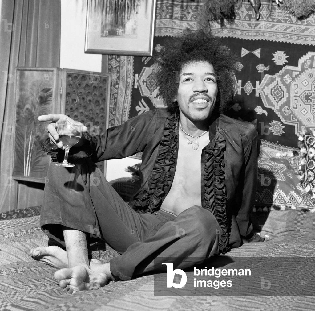 American singer and guitarist Jimi Hendrix pictured at his flat in Mayfair, London, 7th January 1969 (b/w photo)