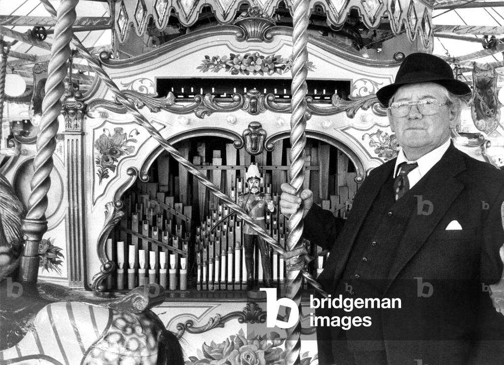 Mr. James Crowe with the renovated Verbeck organ at Whitley Bay fairground in August 1976. 06/08/1976 (b/w photo)