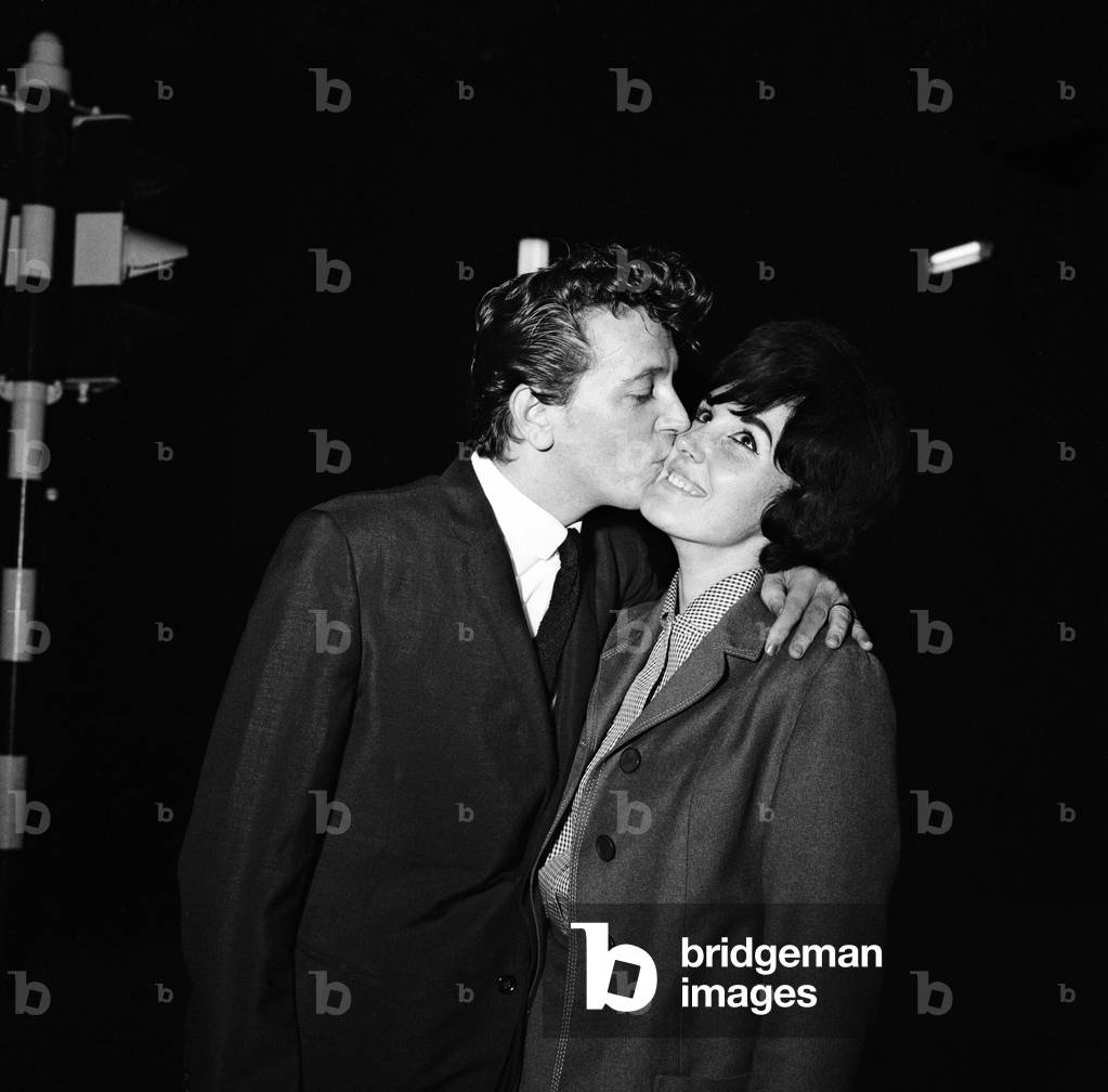 Gene Vincent reconciled with his wife tonight, after a recording session at BBC Players House Theatre in Northumberland Avenue, London. The American pop singer, aged 28, was fined £20 at Marylebone Magistrates Police Court today for possessing firearms - which it was alleged he threatened his wife Margaret with, 23rd September 1963 (b/w photo)