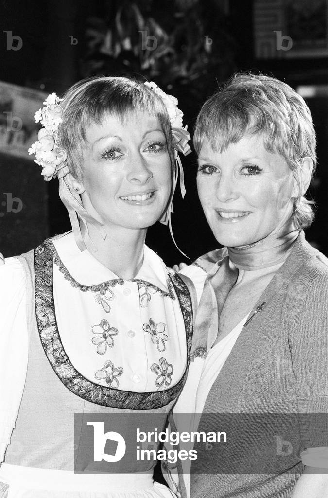 Petula Clark who stars in the hit musical show 'The Sound of Music' at the Apollo Theatre, London, is taking a holiday. Today Petula handed over her role as Nanny to the Von Trapp children to her understudy Lisa Westcott. 6th April 1982 (b/w photo)