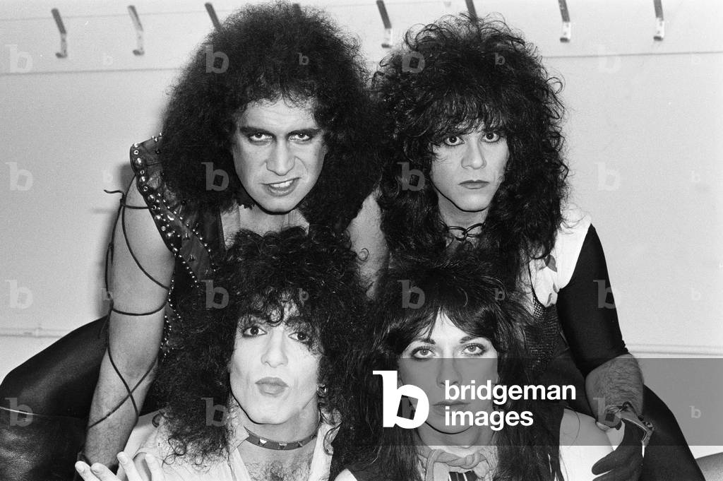 American rock group Kiss seen here in a very quick break between numbers at their concert at Wembley Arena, supposedly the first time they have been seen without their stage make up, 1983