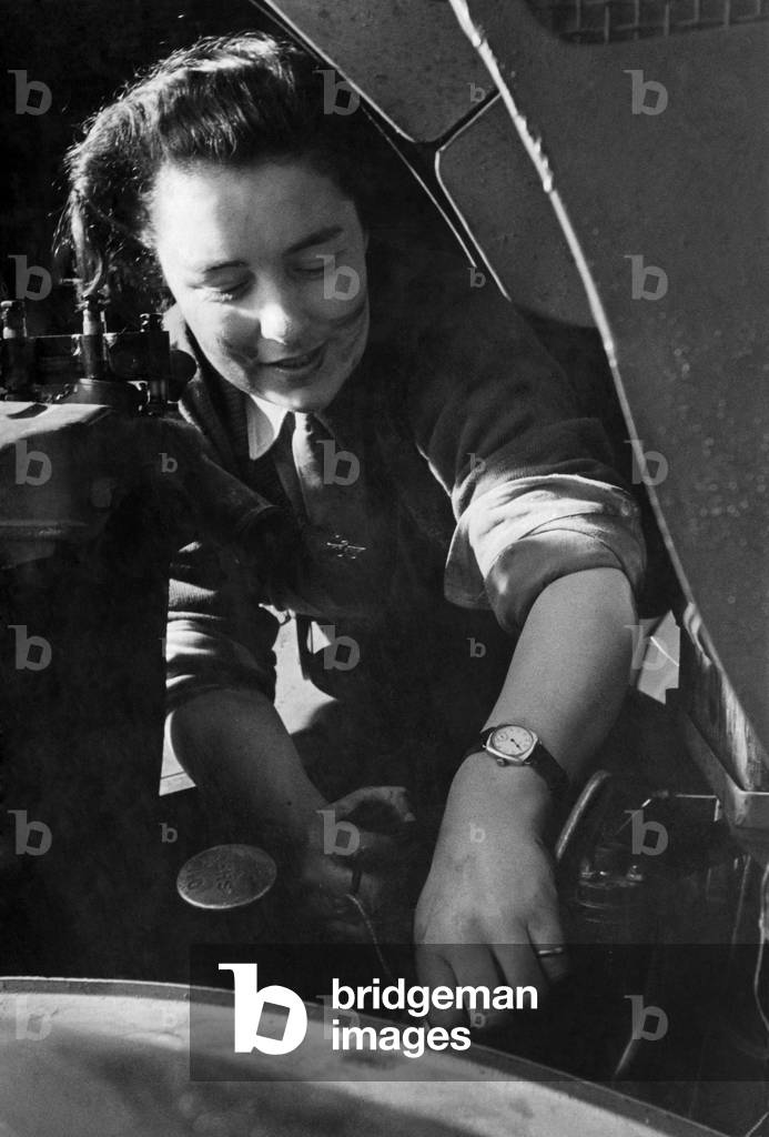 Army Women. A.T.S. Want More Drivers and mechanics. An appeal has been issued for another 600 drivers by the A.T.S. This Study shows woman busy on repairs at Dept. near Nottingham, March 1941 (b/w photo)