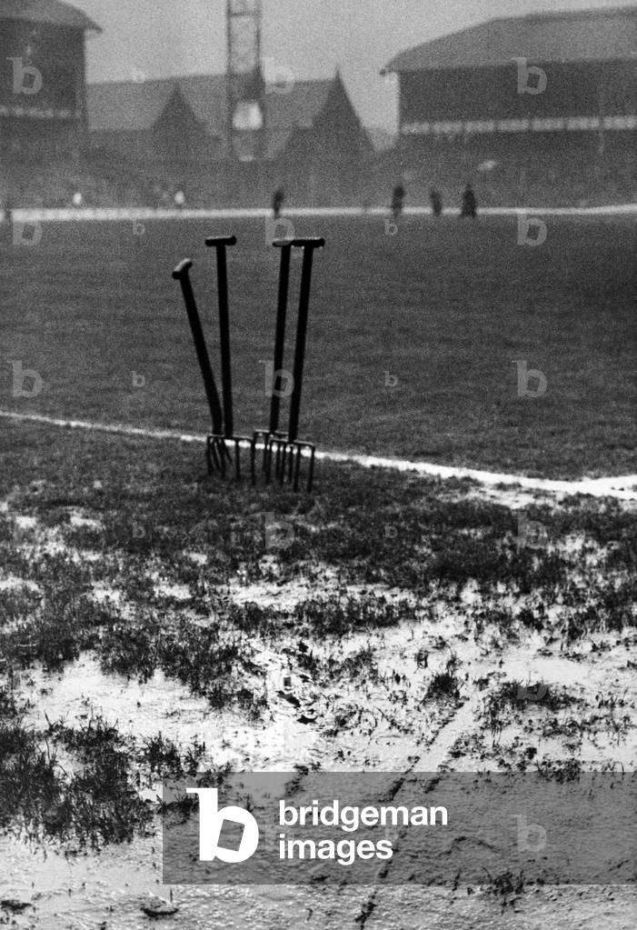Everton 2-0 Fulham, League match at Goodison Park, 18th December 1965. Goodison Park, home to Everton FC, the football stadium is located in Walton, Liverpool, England. Pictured, four forks tell the weather story before the game. Groundsmen worked hard up to the start of the match to prevent the playing area becoming waterlogged (photo)