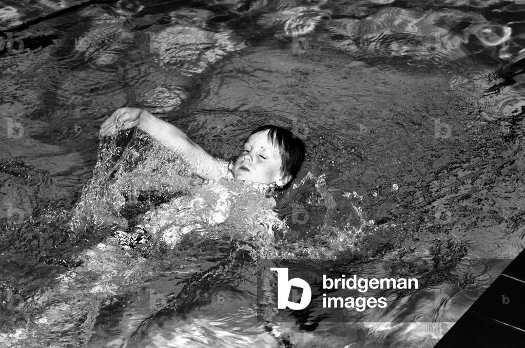 7 year old Alexander Nice who is a member of the Dover Lifeguard Club, at a Dover swimming pool, April 1975 (b/w photo)