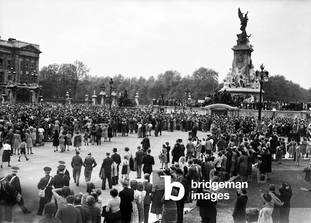 VE Day celebrations in London at the end of the Second World War. Some of the huge crowds gathered outside Buckingham Palace during the celebrations., 8th May 1945 (b/w photo)