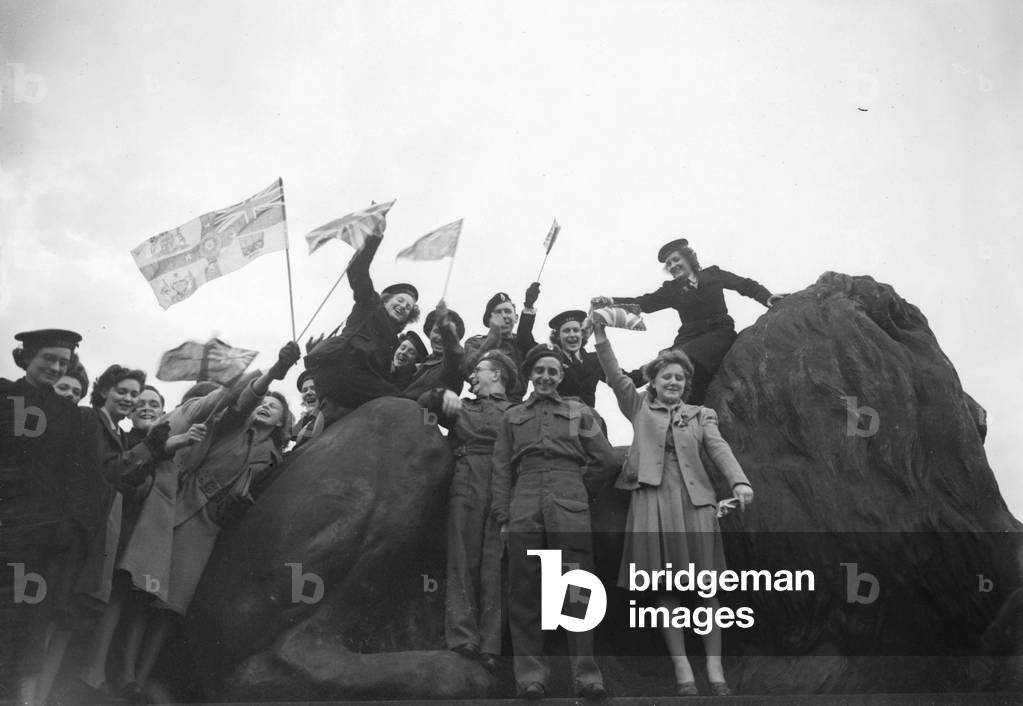Wrens, Soldiers and Civilians celebrating in Trafalgar Square following the announcement of Victory in Europe, London, 1945 (b/w photo)