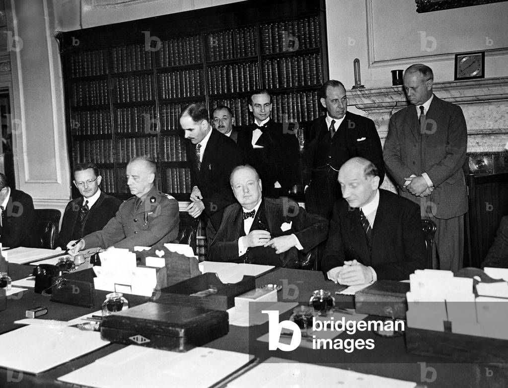 Sir Winston Churchill seen here signing an agreement between Great Britain and Poland, August 1940 (b/w photo)