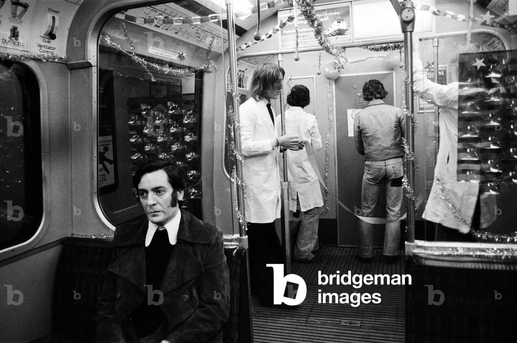 Students from the Central School of Art and Design, decided that Christmas should come to London's Underground. So they decorated a carriage of an underground train on the Circle line. London, 9th December 1974 (b/w photo)
