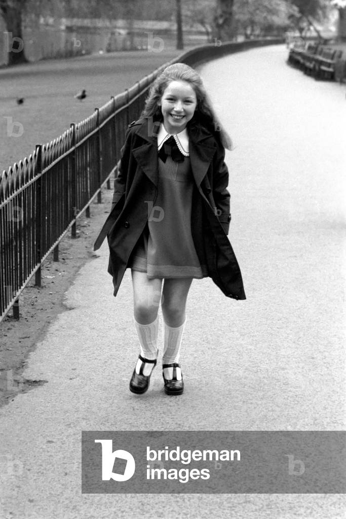 Lena Zavaroni enjoying herself in Green Park, London, March 1975 (b/w photo)