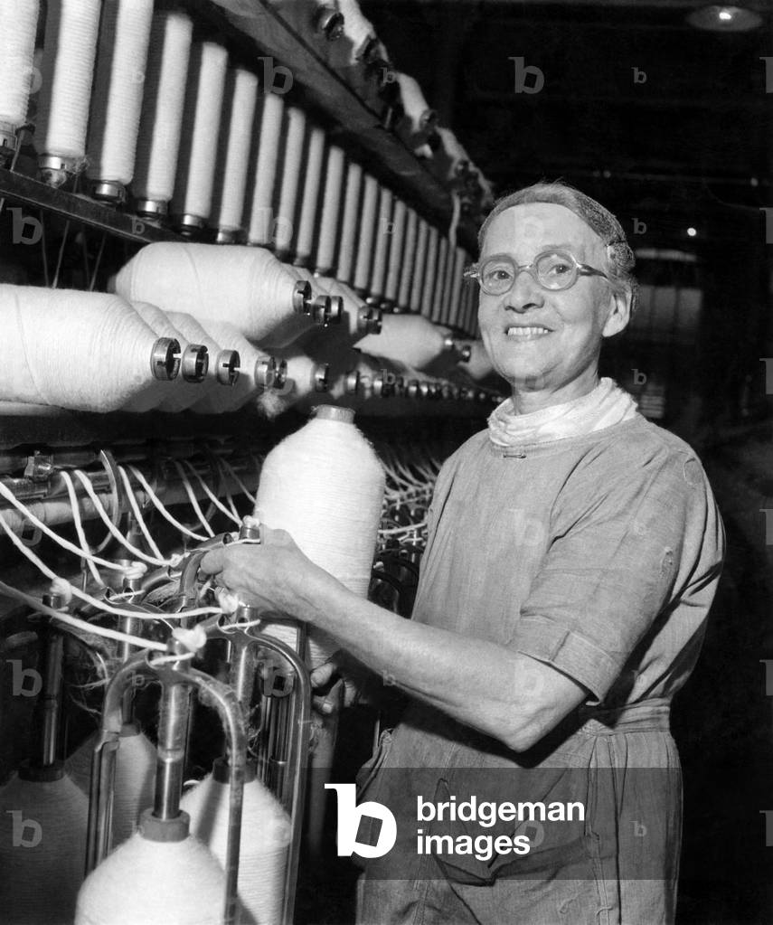 A Lancashire Mill fights back. Oldest worker in the mill is 70 year old Mrs. Warren who has worked in the Vine for 40 years. Often she gets tired in the afternoons but the manager allows her to go home whenever she feels like it. June 1947
