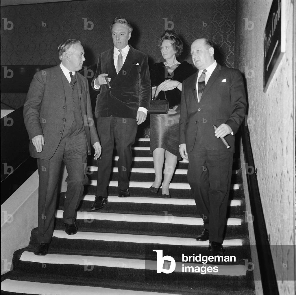 Media mogul Lew Grade (right) pictured with Prime Minister Harold Wilson (left), Hugh Cudlipp and Mrs Mary Wilson, wife of the PM for ATV's Golden Drama, a star studded production at the Queens Theatre. 31st January 1965 (b/w photo)