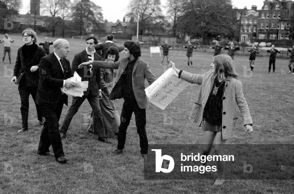 The South African springbok rugby team that flew in yesterday to be welcomed by anti-apartheid demonstrators at London Airport were shouted at and had banners waved in their faces during their practice session at the Richmond Athletic Association ground. 
The demonstrators were escorted from the ground by the police. Mr. John Secretary of Richmond Athletic Association (dark suit with tie rushes to tear up the banners). 
October 1969