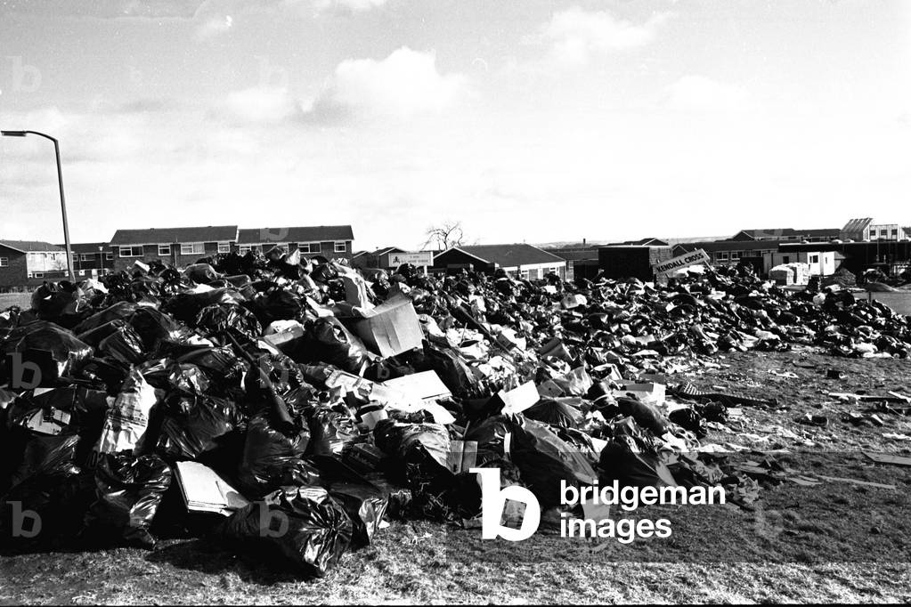 Rubbish piling up outside the St Peters RC Middle School, Cramlington during the refuse collectors strike on 14th March 1979 (b/w photo)