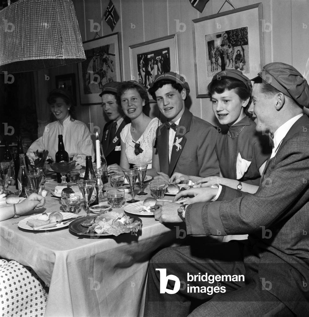 Norway Independence Day. Students Having an all night first footing party, where they get all sorts of people out of their beds to toast the king and queen and to have breakfast with them on the morning of independence day. May 1953 D2718-007