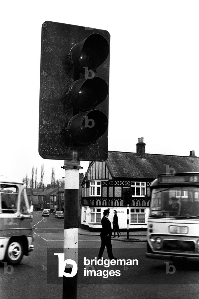 A policeman directs traffic at the junction by the New Inn, Church Street Head, Durham. The traffic lights are out of action due to the power strike. 07/01/1970
