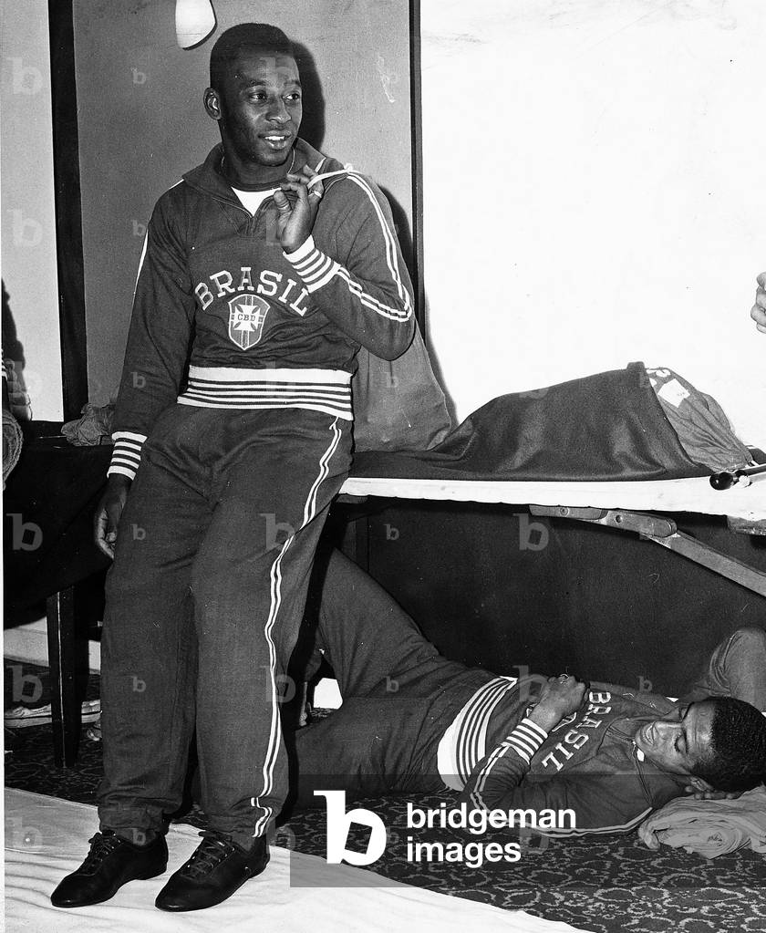 Pele Brazilian football player in team track suit with team mate Altair under the table 1966 (photo)