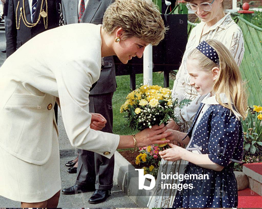 Princess Diana the Princess of Wales. (North East visits). Katherine Mundy, 8, hands flowers to Princess Diana on her visit to St Peter's Basin, Newcastle. 3rd April 1991 (photo)