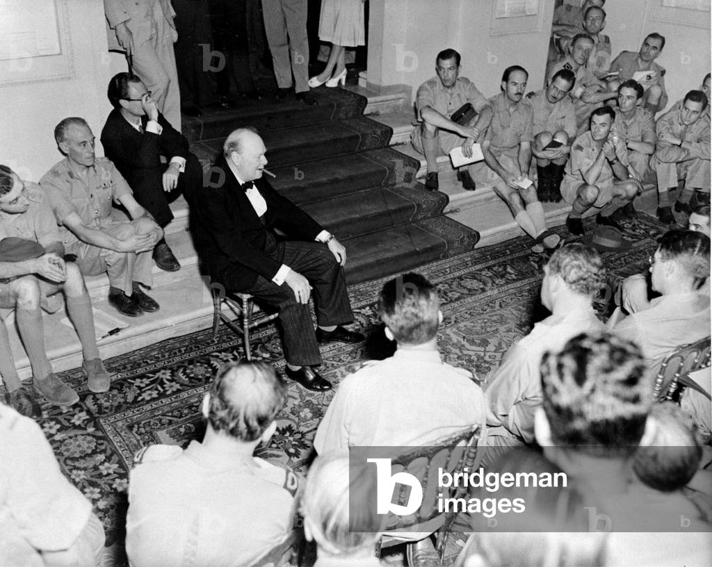 British Prime Minister Winston Churchill photographed with British and American War correspondents during an informal talk at the British Embassy in Rome, Italy in World War Two, 23rd August 1944 (b/w photo)