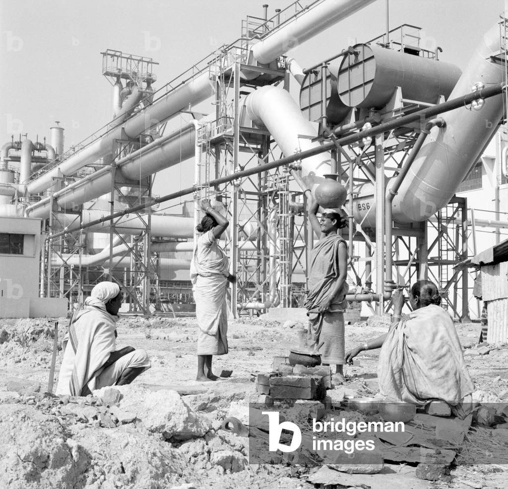 Women water carriers seen here at the Durgapur steel works in West Bengal, India, February 1961 (b/w photo)