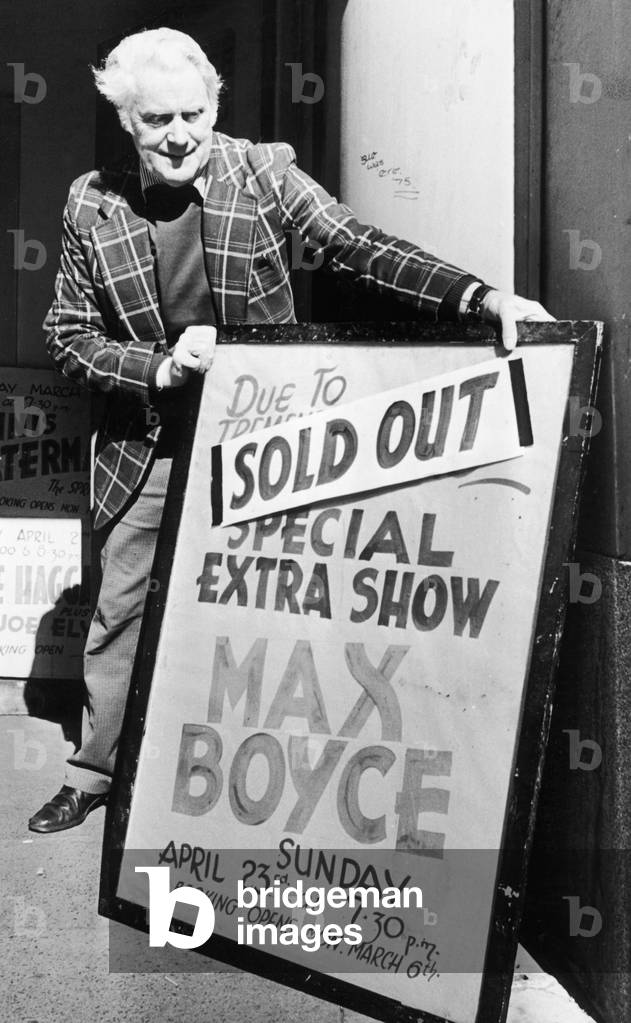 Theatre worker Ted Grant places the sign outside the Coventry Theatre telling the bad news for Max Boyce fans, that the tickets have sold out. 6th March 1978 (b/w photo)
