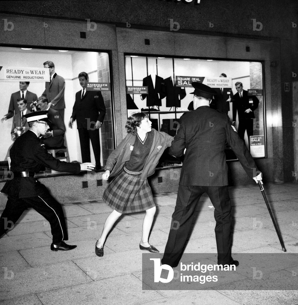 Police try to control fans in the streets of Liverpool before the premiere of the Beatles film 'A Hard Day's Night', 
July 1964