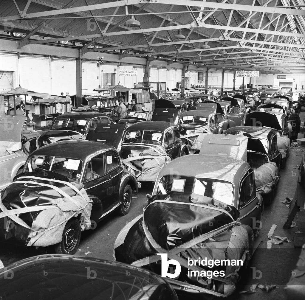 Morris Minor Low Light Sedans fresh of the production line, wrapped before being packed for export at Morris's Cowley factory 24th March 1949 (b/w photo)