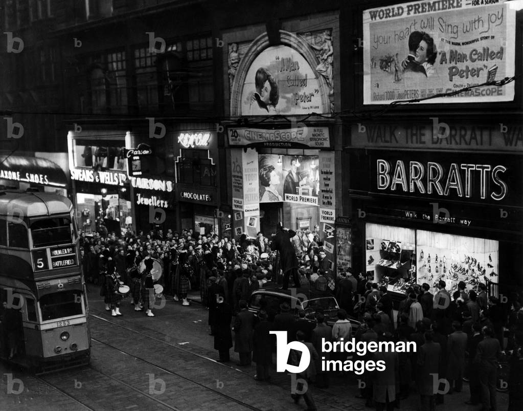 Crowds outside La Scala Cinema watch celebrities arrive for the world premiere of film, A Man Called Peter, Sauchiehall Street, Glasgow, Scotland, 30th March 1955.