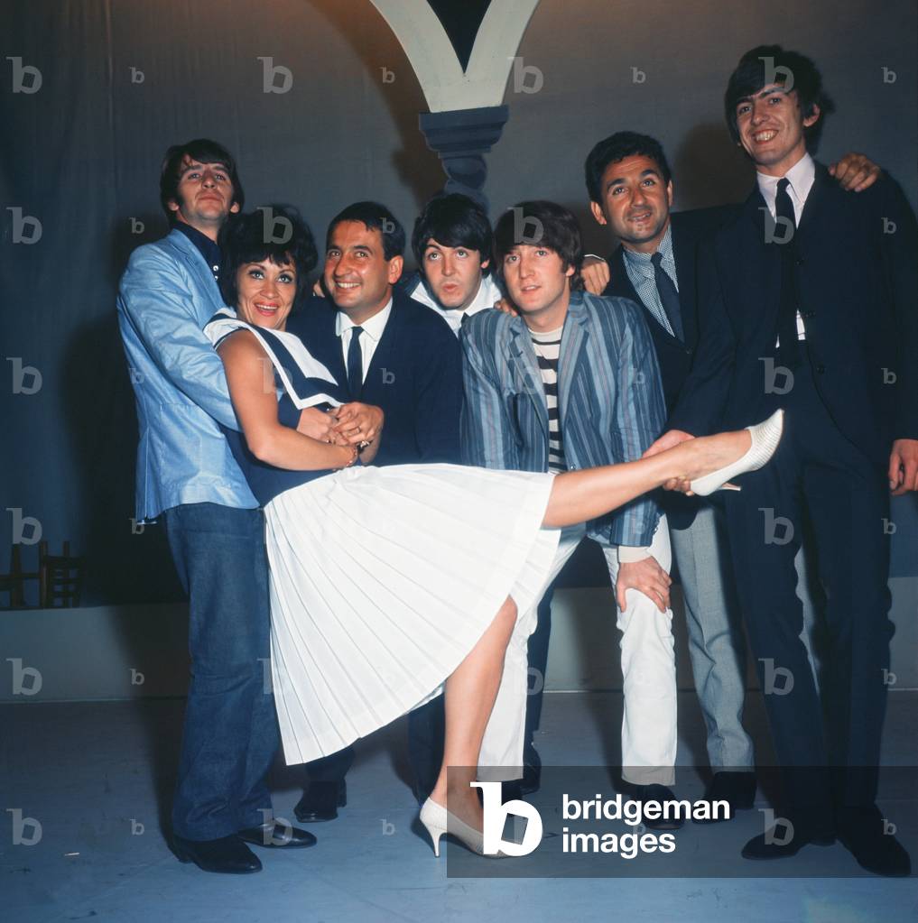 The Beatles pop group with Mike and Bernie Winters and Chita Rivera during rehearsals for the Blackpool Night Out show. 19th July 1964 (photo)