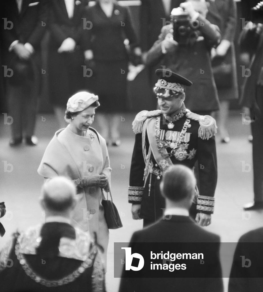Mohammad-Reza Shah Pahlavi, the Shah of Iran with Queen Elizabeth II during his visit to Britain.
5th May 1959.