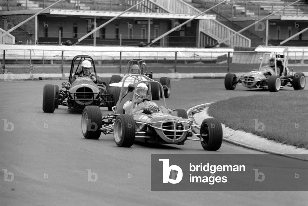 Mini Grand Prix: White City Stadium: Graham Hill, March 1975 (b/w photo)
