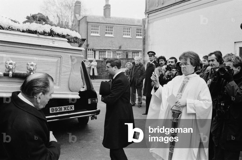 Requiem Mass for Irish rock star Phil Lynott, lead singer of Thin Lizzy, held at a church in Richmond, Surrey. The coffin is carried out of the church after the service to the hearse. 9th January 1986 (b/w photo)