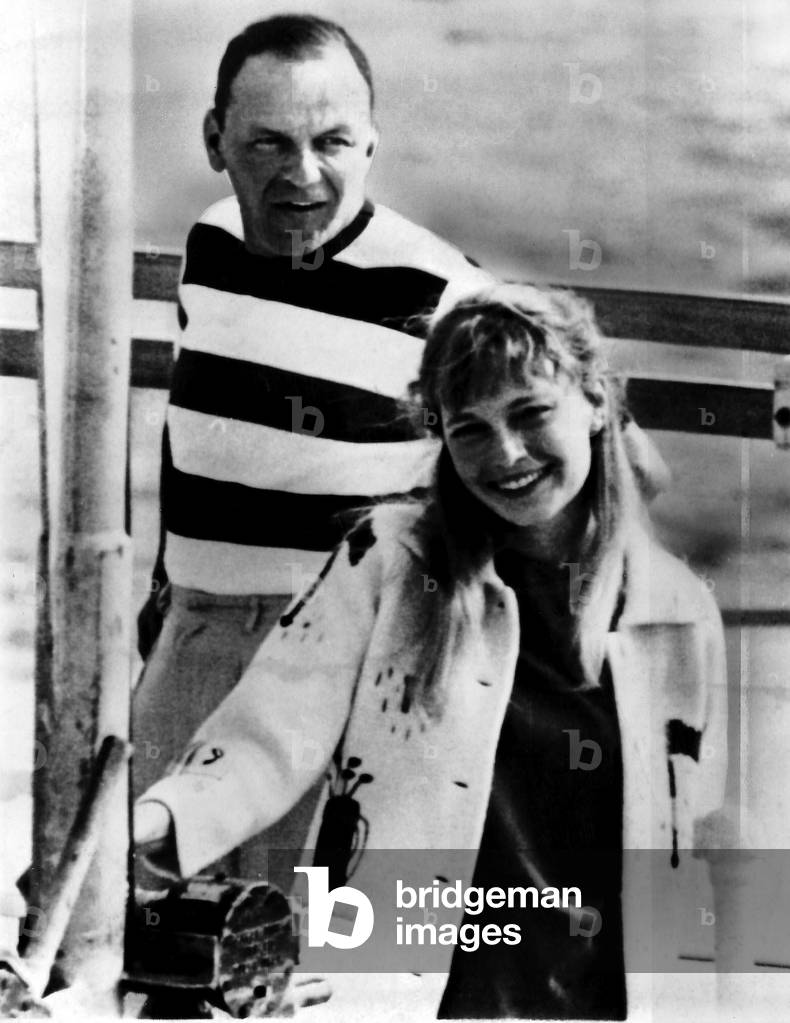 Frank Sinatra with Mia Farrow on a boat