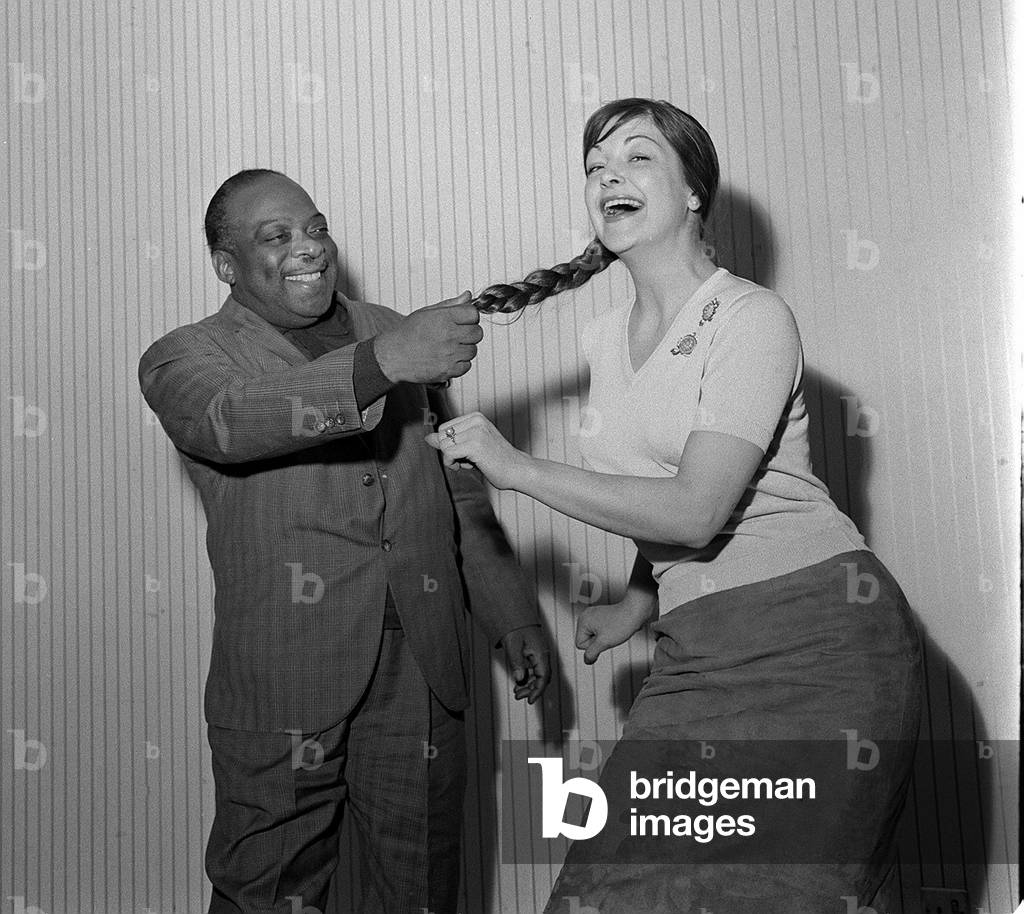 Jazz great Count Basie in Manchester for a recording session at Granada studio's clowns around with Singer Annie Ross as she shows him 'The Twist', 1962 (b/w photo)
