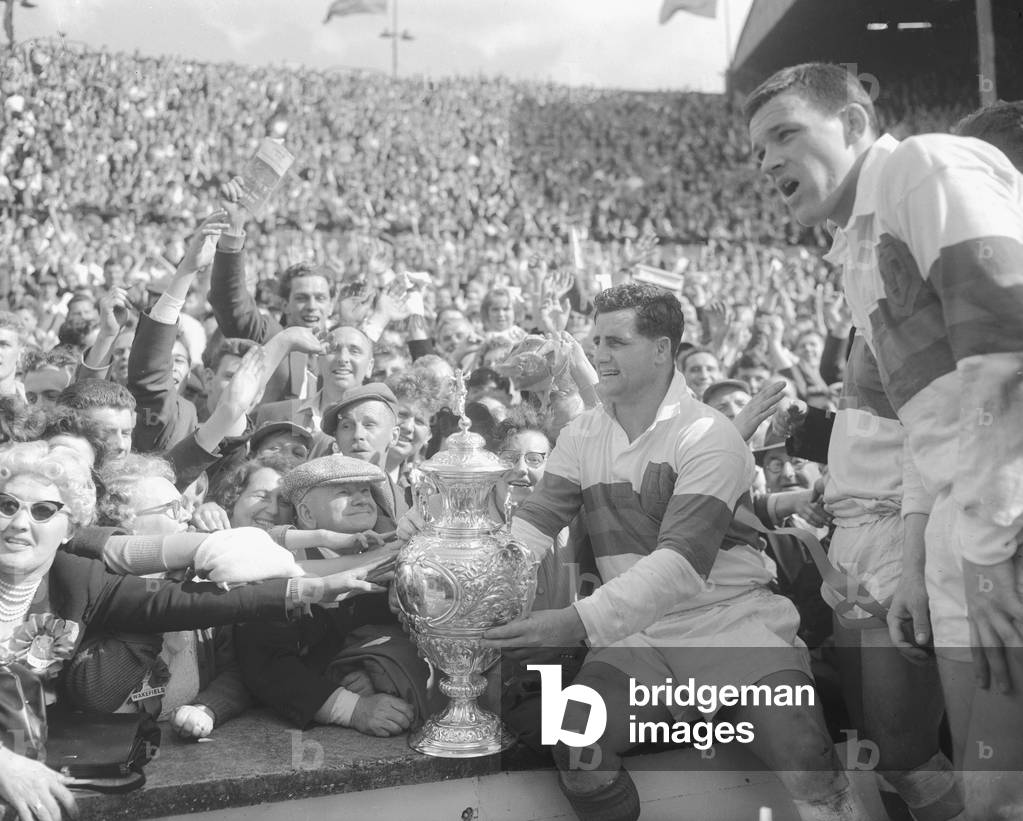 Derek Turner of Wakefield Trinity shows the trophy to fans after their 25 - 10 victory over Wigan during the Rugby League Cup Final at Wembley. 11th May 1963