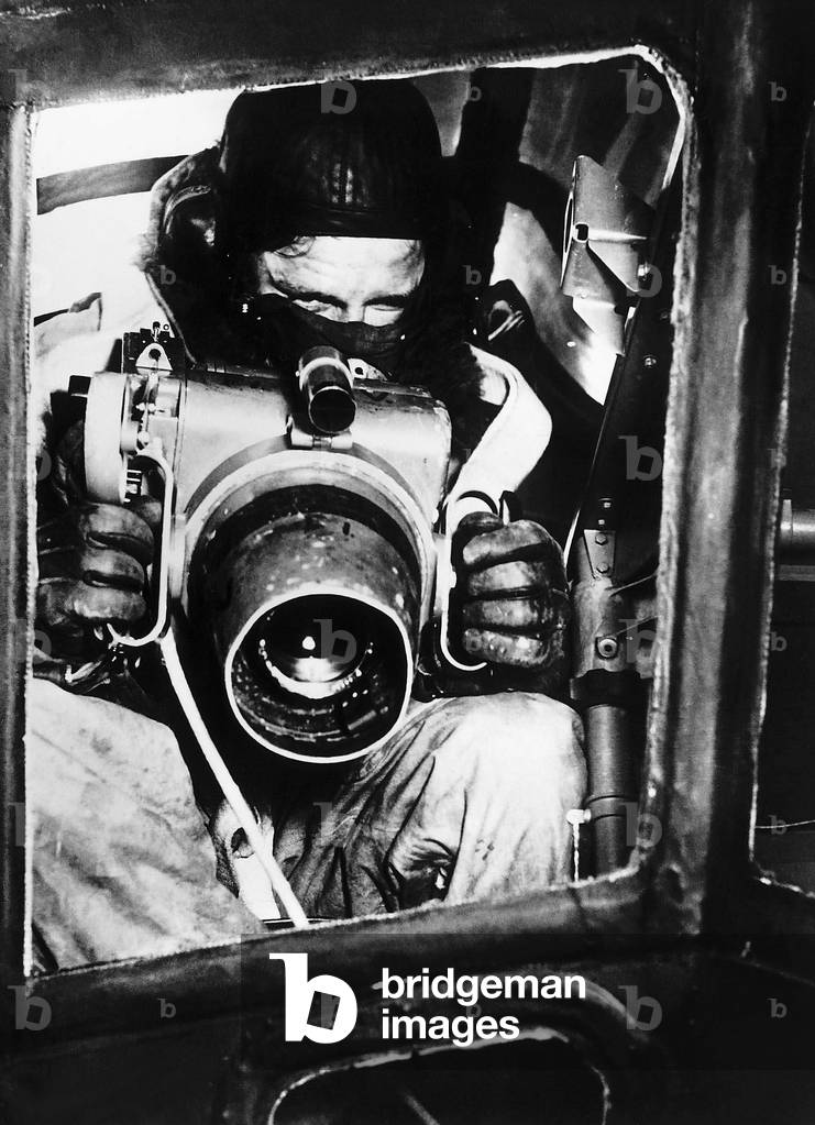 A Royal Air Force observer with the oblique camera used in reconnaissance work in WW2, c. 1942 (b/w photo)