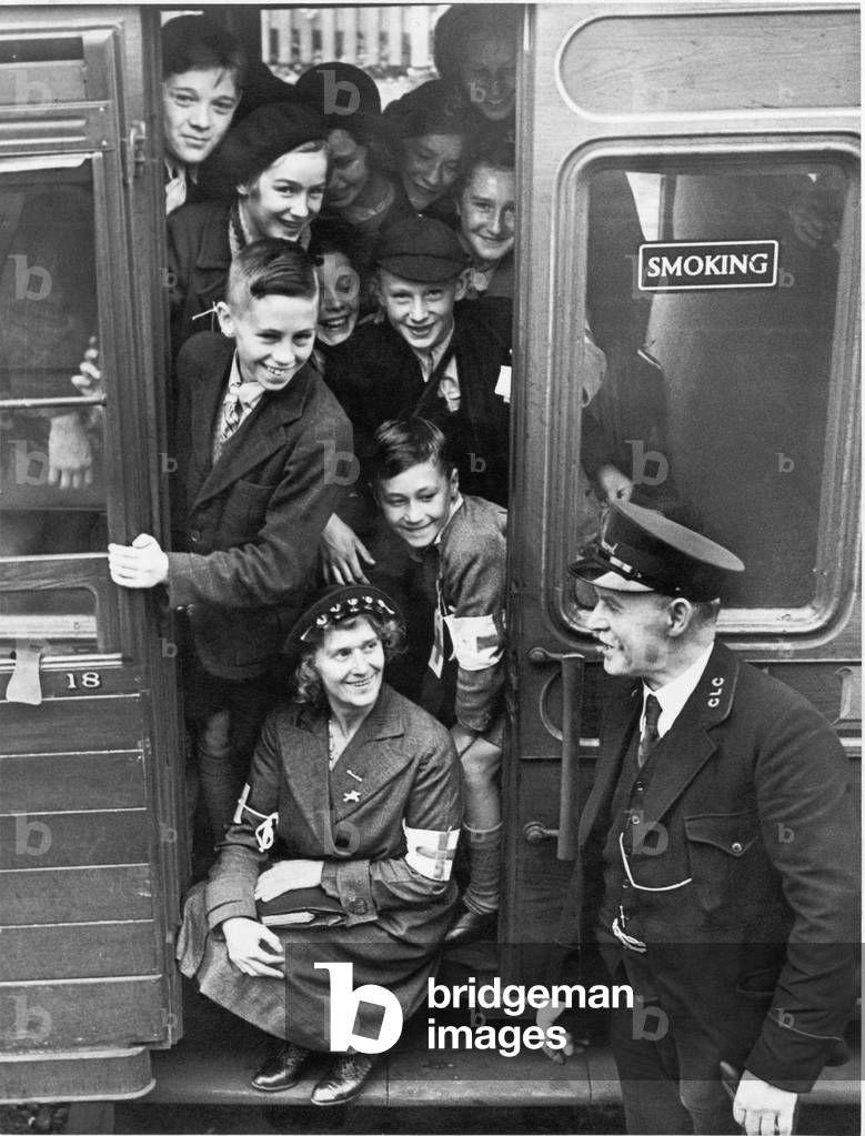 A carriage filled with evacuees waits for the guard to blow his whistle. 
2nd September 1939