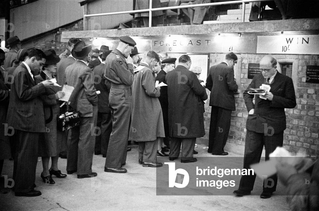 A night at the dogs, general views of the track and characters that work at the White City Greyhound Track. 7th September 1946 (b/w photo)
