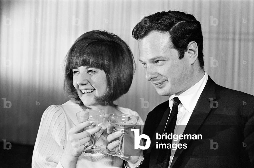 Cilla Black with Brian Epstein, at her 21st birthday party. 27th May 1964.