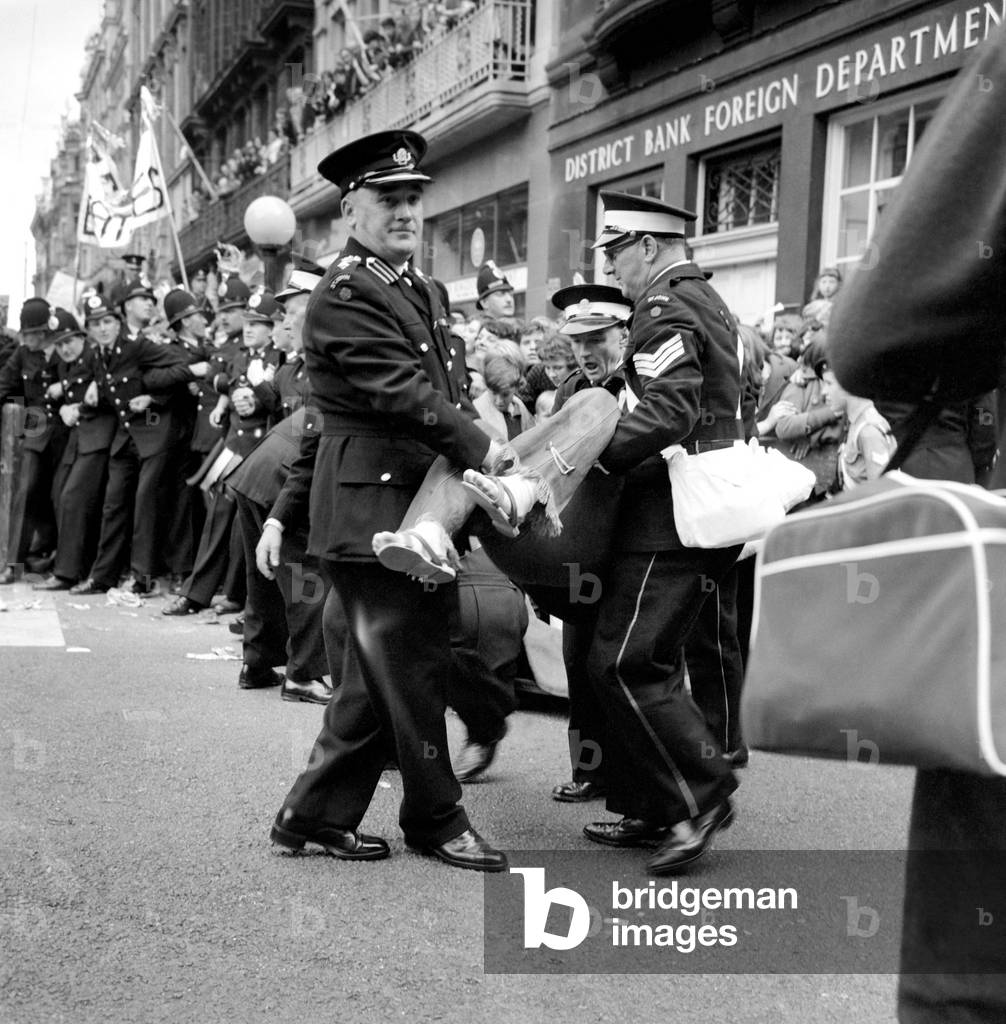 Northern premiere of The Beatles film A Hard Day's Night in Liverpool. 
Police help injured fans who were crushed while waiting for the group to arrive. 
July 1964