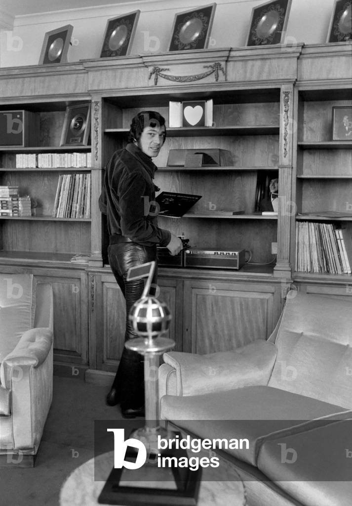 Engelbert Humperdinck's new home in St. Gerorge's Hill, Weybridge 
Engelbert in his snug, where he keeps his gold records and other awards. 
December 1969