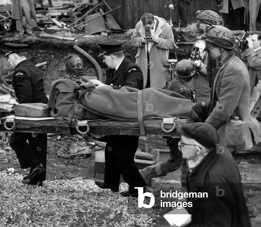 Coal Mining accident in Hapton Valley colliery in Lancashire. Rescue workers taking away bodies on stretchers.