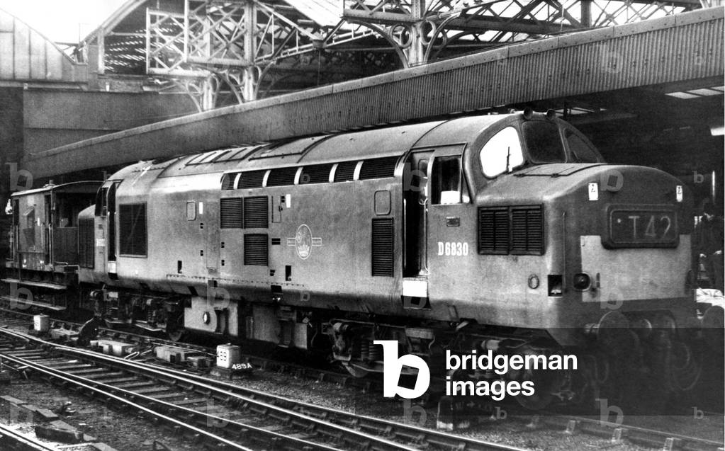 A double ended diesel electric locomotive and brake van in Newcastle Central Station on 3rd December 1967