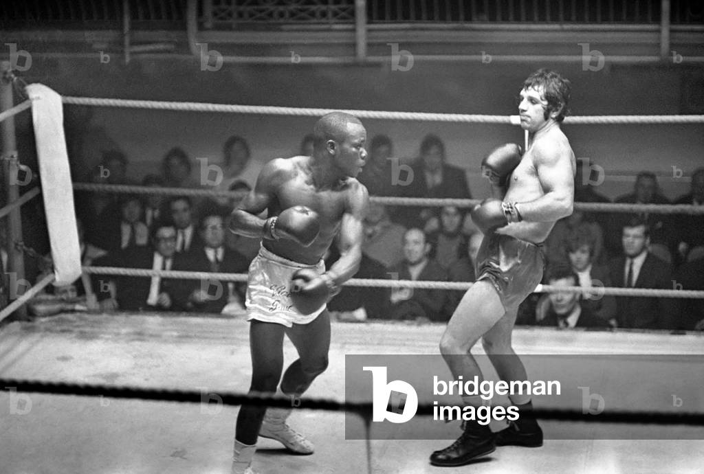 Boxing at Lime Grove Baths in Shepherd's Bush, London Vic Andretti in action to defeat Victor Paul during their lightweight bout. 
November 1969