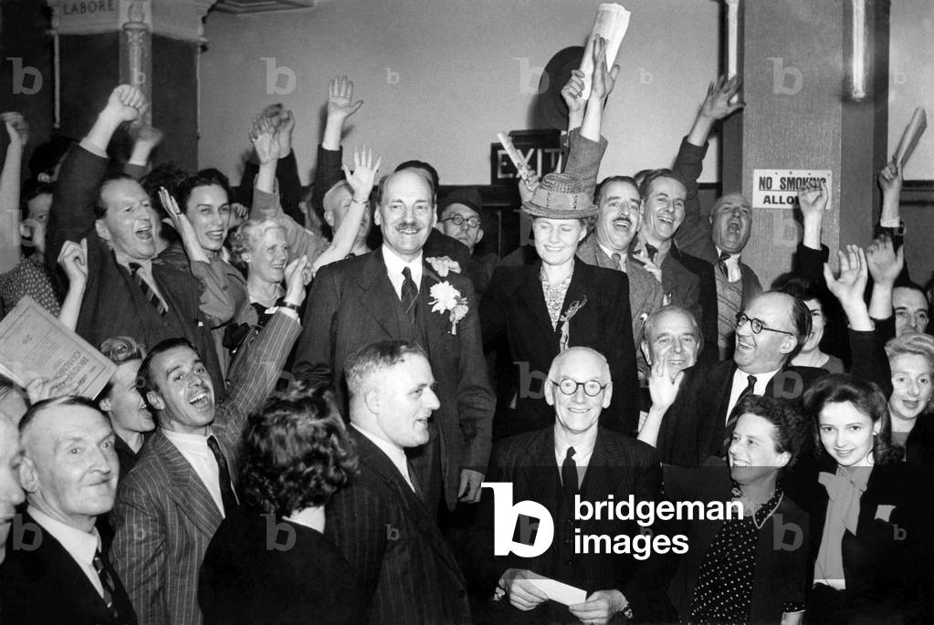 New Prime Minister Clement Attlee celebrates with supporters after labour's surprise victory in the General Election.