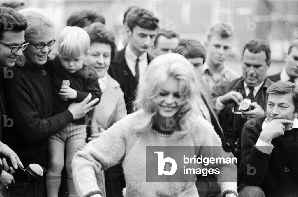 Brigitte Bardot surrounded by fans, London, 1963 (b/w photo)