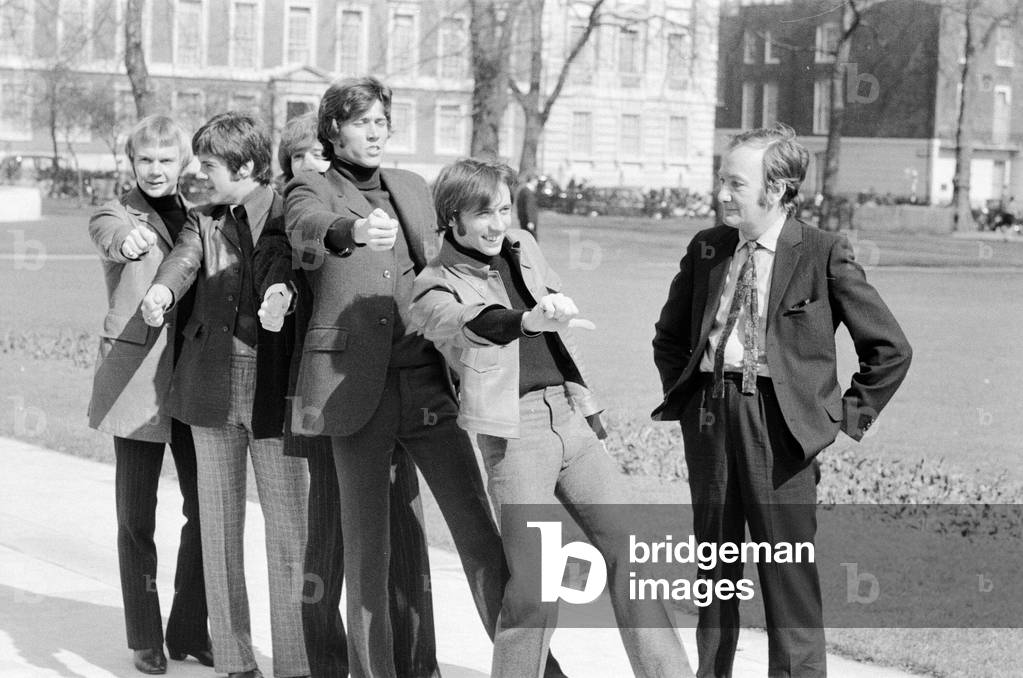 Johnny marches The Bee Gees through London as he gives them a taste of what's to come, 29th March 1968 (b/w photo)