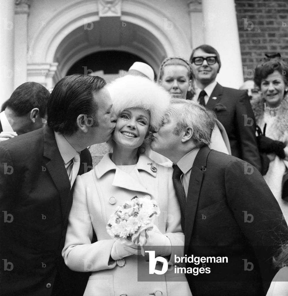 Film (French) actress Dany Robin married agent Michael Sullivan at 11.30 Sunday at Epsom Registry Office. Big kiss from Jack Douglas for Bride Dany Robin - and (right) Dick Emery. November 1969
