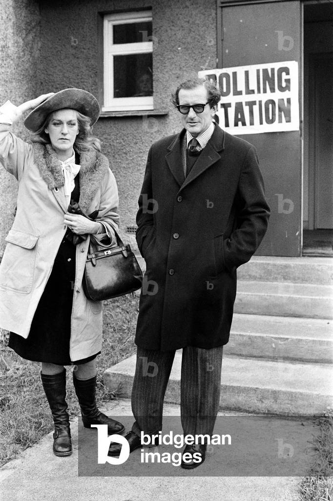 Berwick-upon-Tweed By-Election, Lord Lambton whose resignation over the 'Call Girls' affair caused the election - goes to vote at the polling Station at Doddigton near Wooler, Northumberland. Pictured with his wife Lady Lambton. In 1973, Lord Lambton's liaisons with prostitutes were revealed in The News of the World. 11th November 1973 (b/w photo)